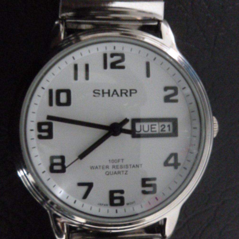 SHARP  WATCH  $18.00  KEEPS  TIME